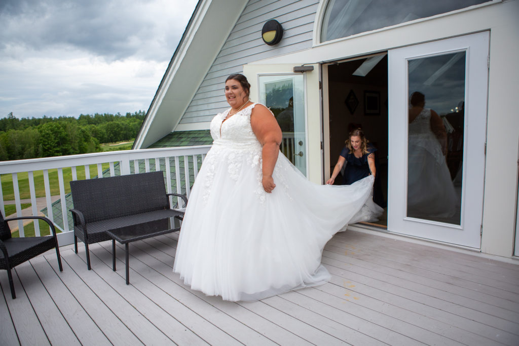 bride walking out on the deck to the first look