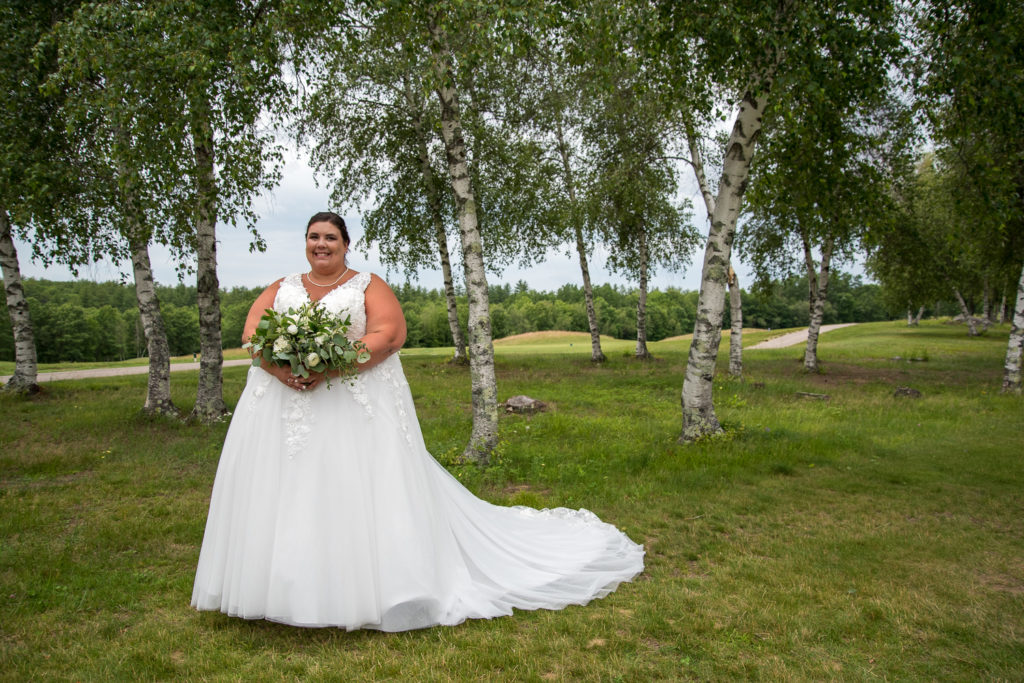 bride with white birch trees at the golf course of Stonebridge Country Club