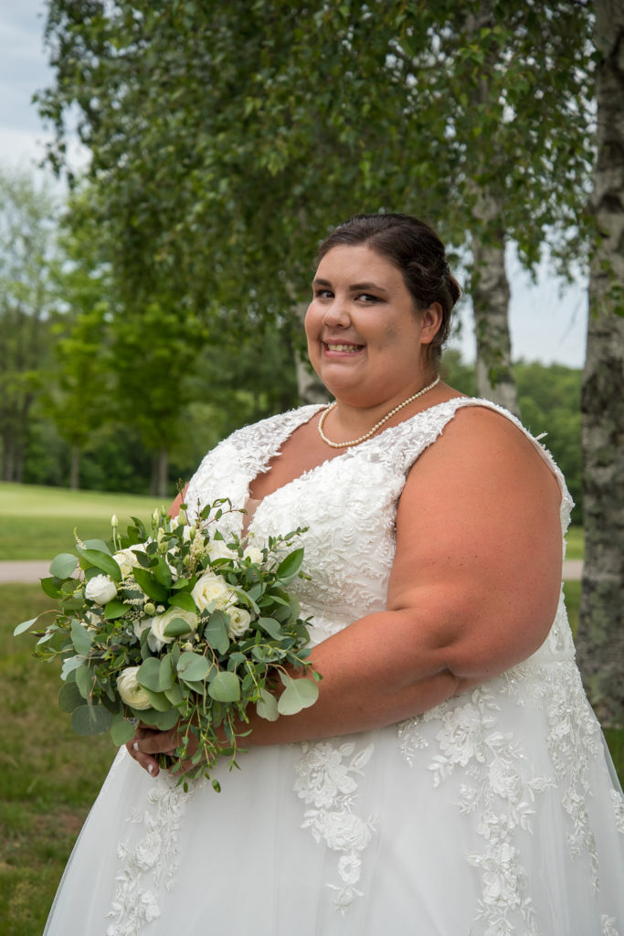 bride with white birch trees at the golf course of Stonebridge Country Club