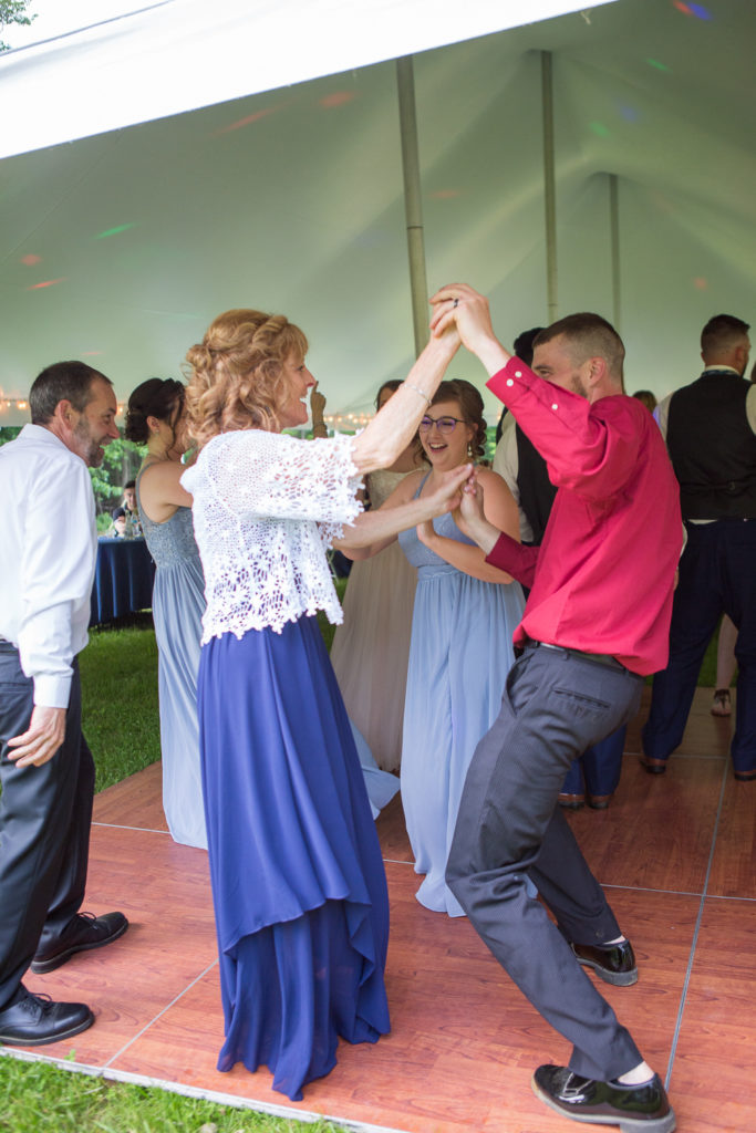 guests dancing at backyard summer wedding