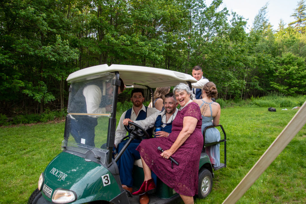 groomsmen on the golfcart with groom's grandmother