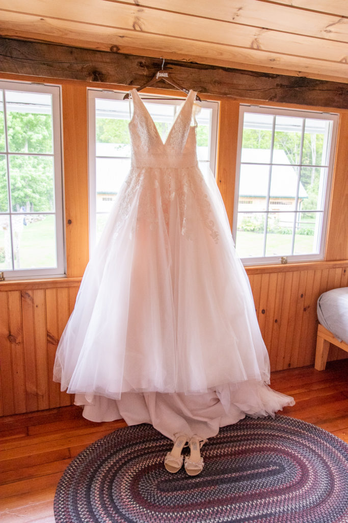 bride's dress hanging in the window
