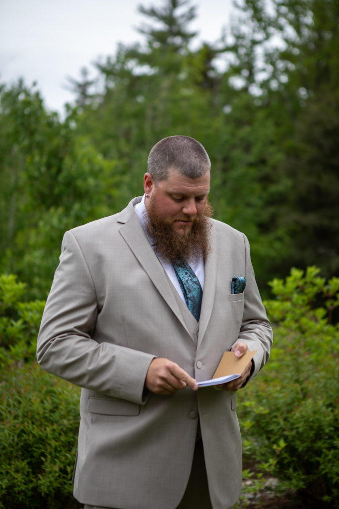 groom reading vows that his bride to be wrote for him