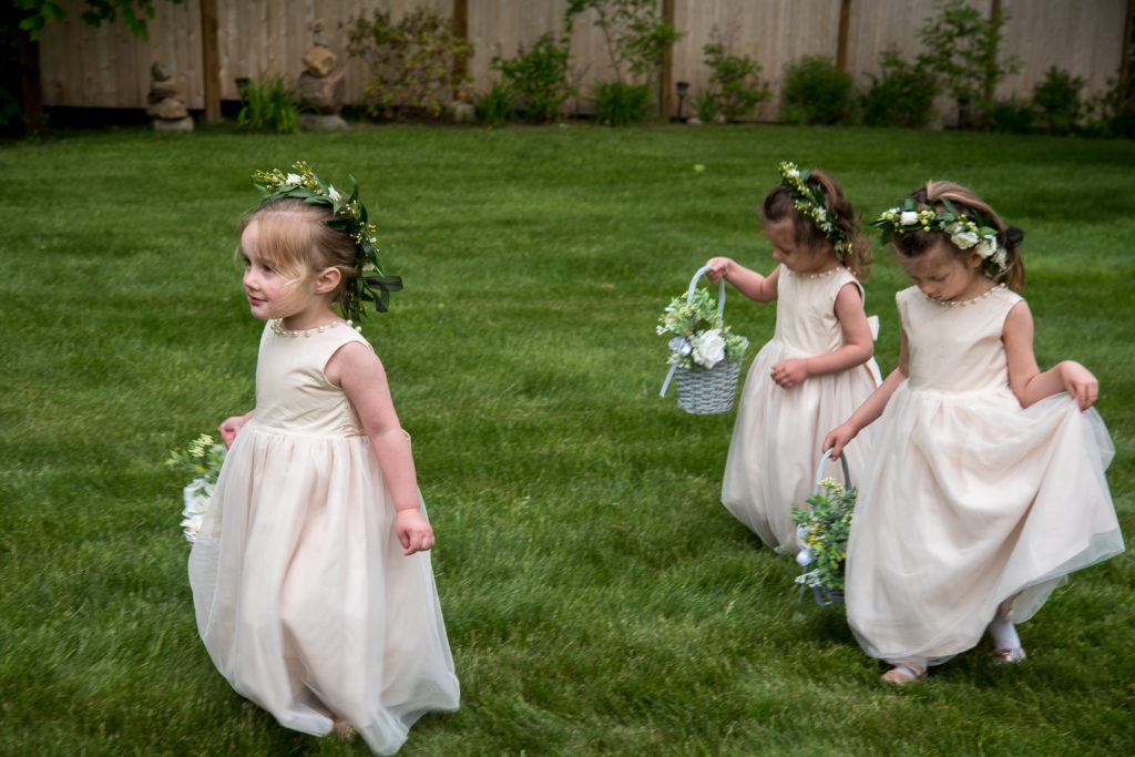 flower girls getting ready to walk down the aisle