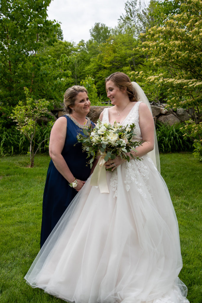 bride with her mom - both looking at each other