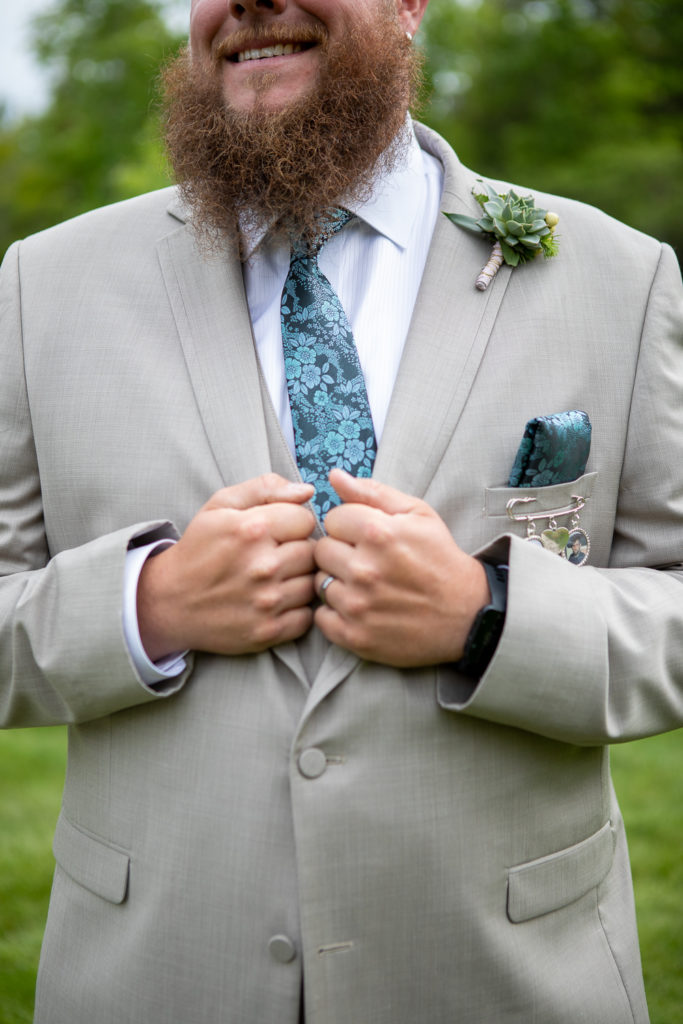 groom holding his jacket