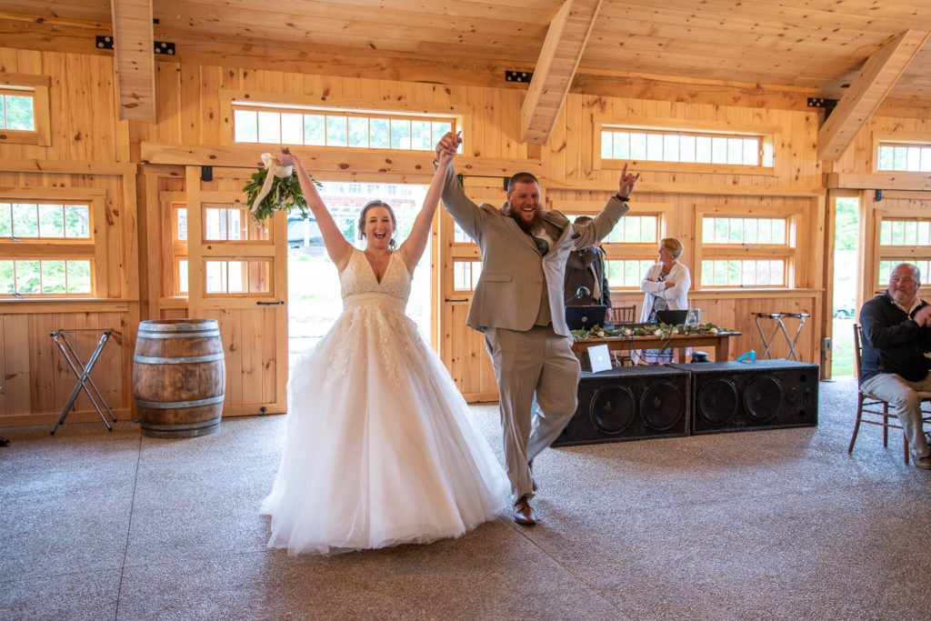 bride and groom's entrance to their rustic elegant reception at Locke Falls Farm