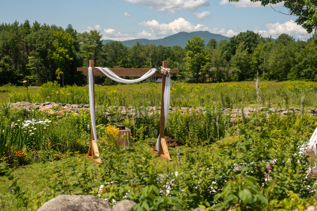 ceremony space in the garden with mountains in the background 