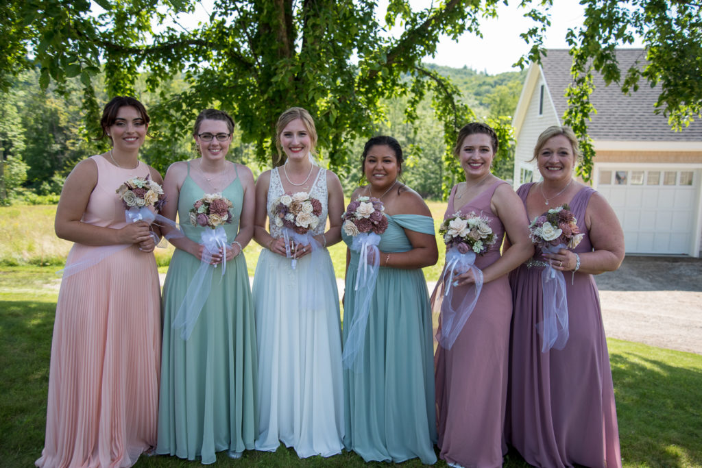 bride with her bridal party at NH summer barn wedding