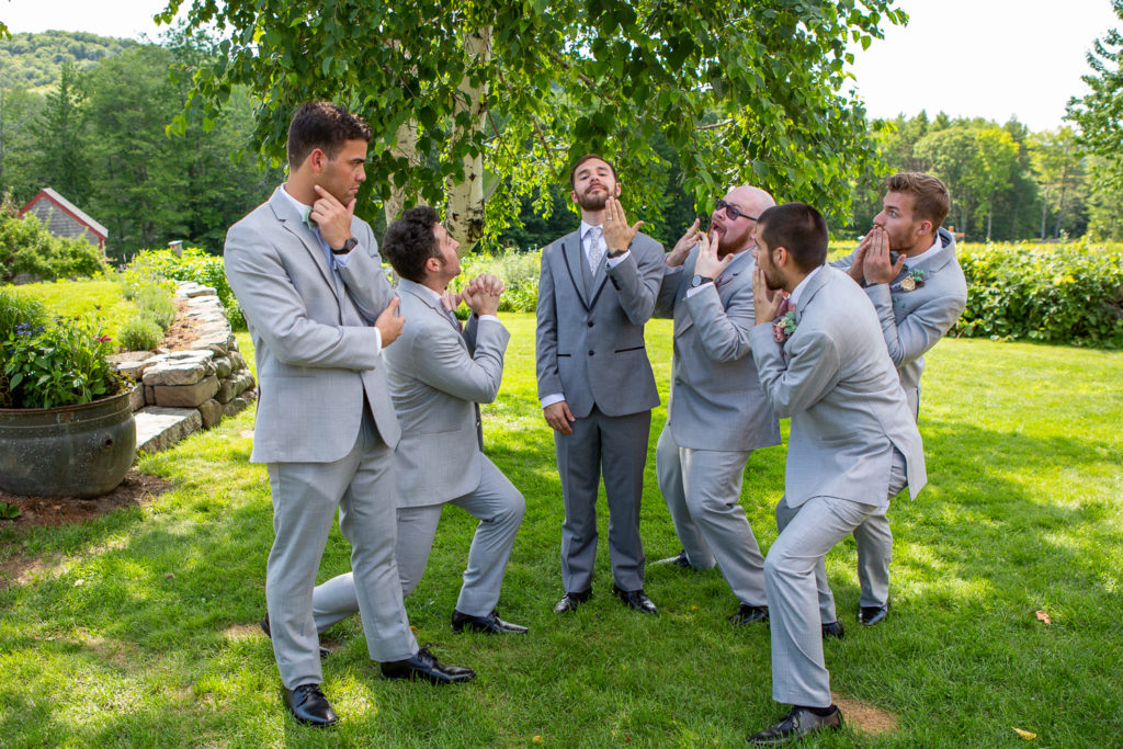 groom and his groomsmen being funny