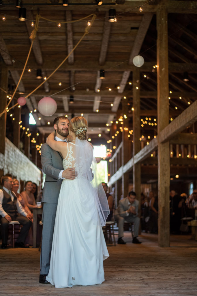 first dance as husband and wife at NH summer barn wedding