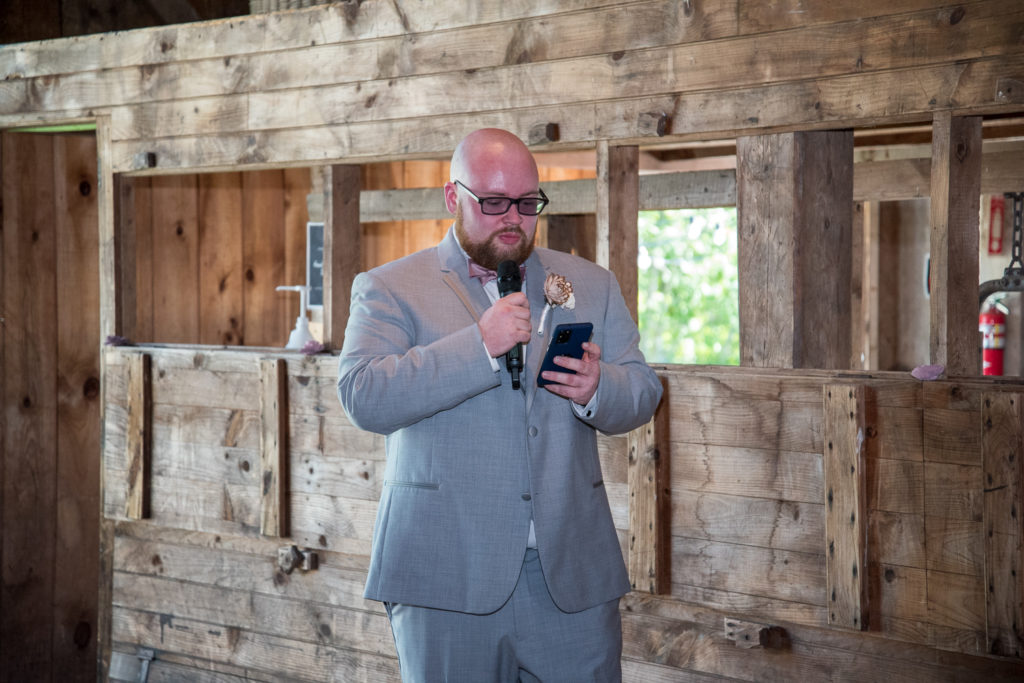 best man giving his speech at NH barn summer wedding