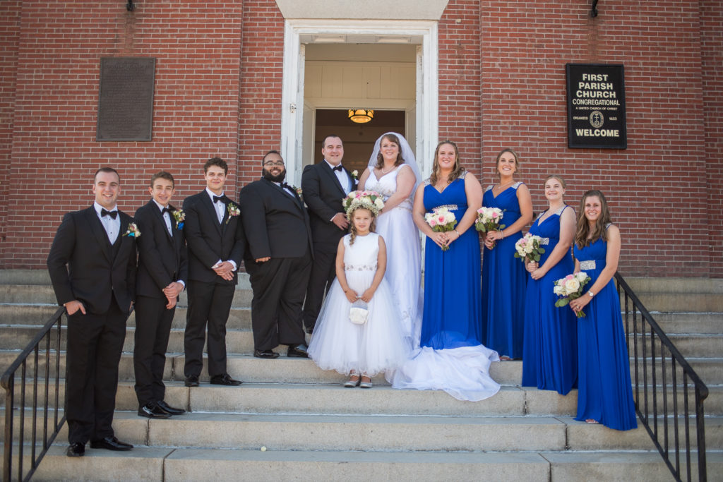 bridal party with bride and groom at church