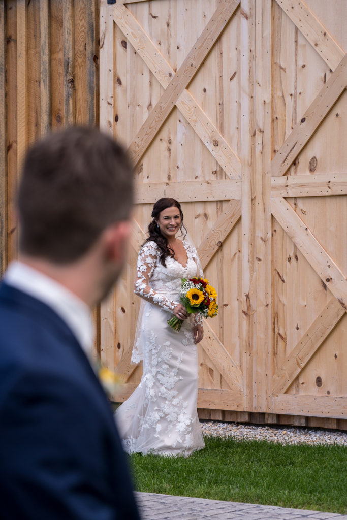 first look with bride and groom at fall wedding at the barn at bull meadow
