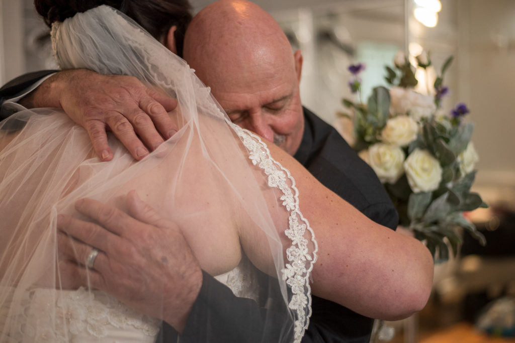 Derek & Tiffany (bride and groom) wedding - Tiffany hugging her dad after their first look