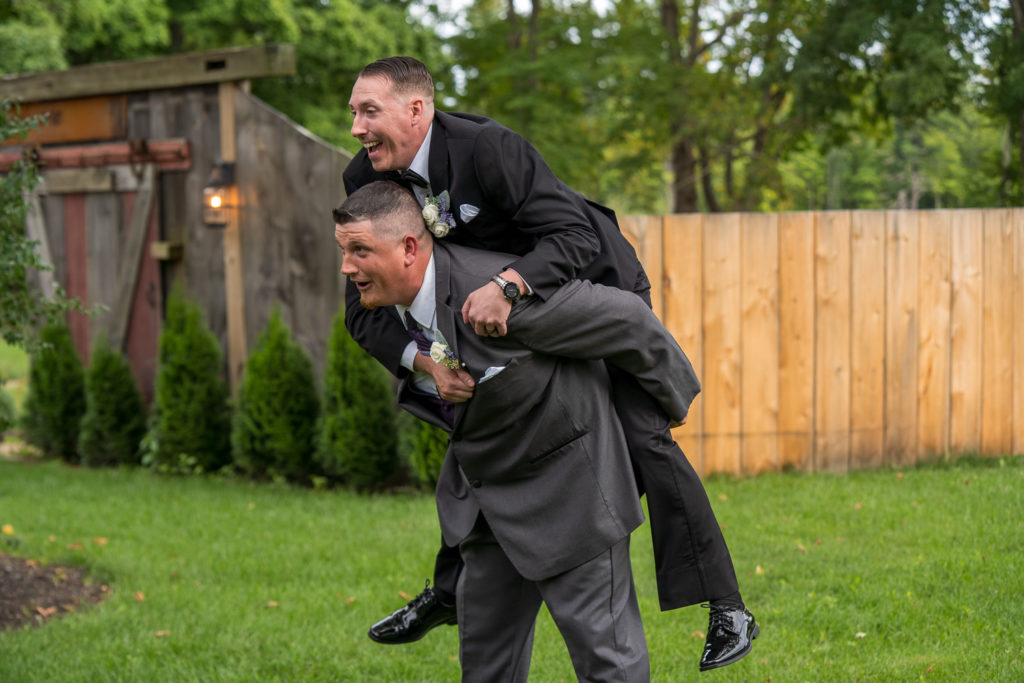 Derek & Tiffany (bride and groom) wedding - Derek jumping on the back of his groomsmen
