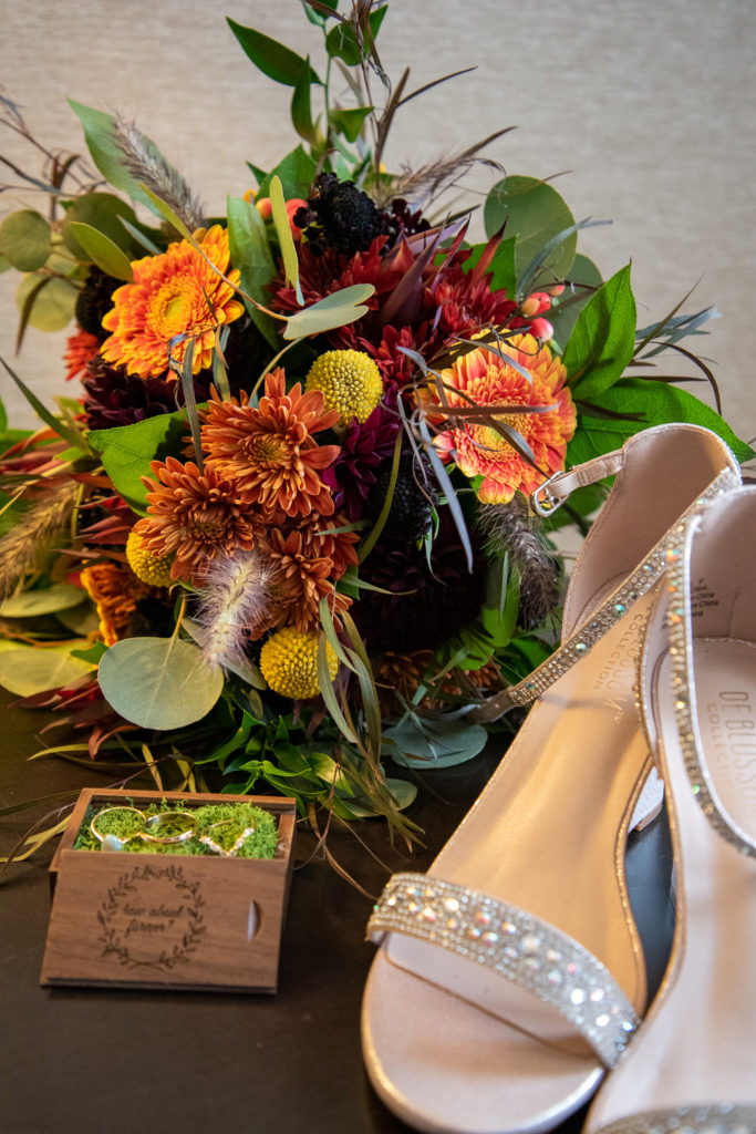 details shot with bouquet, shoes, and rings