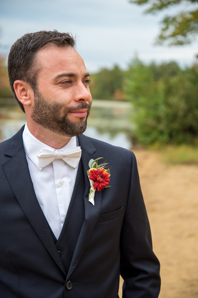 close up of the groom at a beach while waiting for bride, shot by NH wedding Photographer