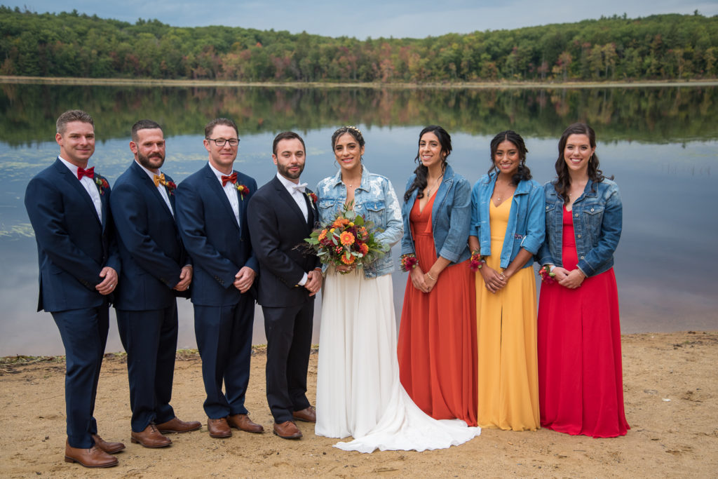 bridal party in front of Shellcamp Pond with foliage in the back