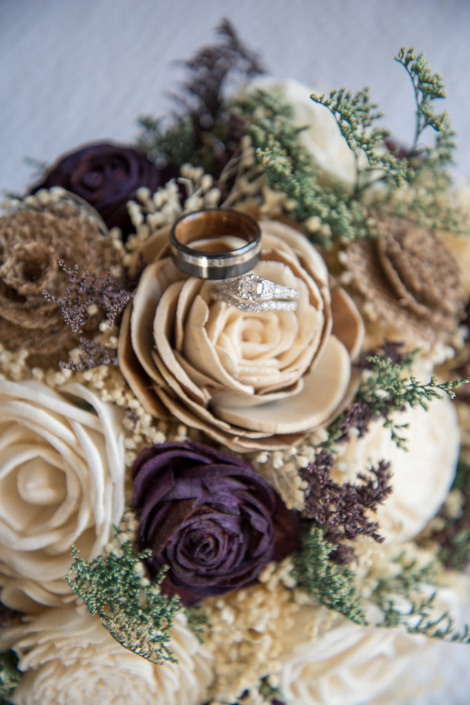 wooden flower bouquet with rings on top