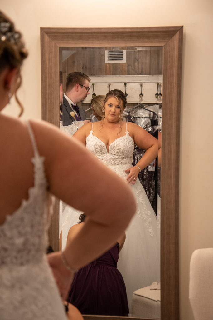 bride looking into the mirror