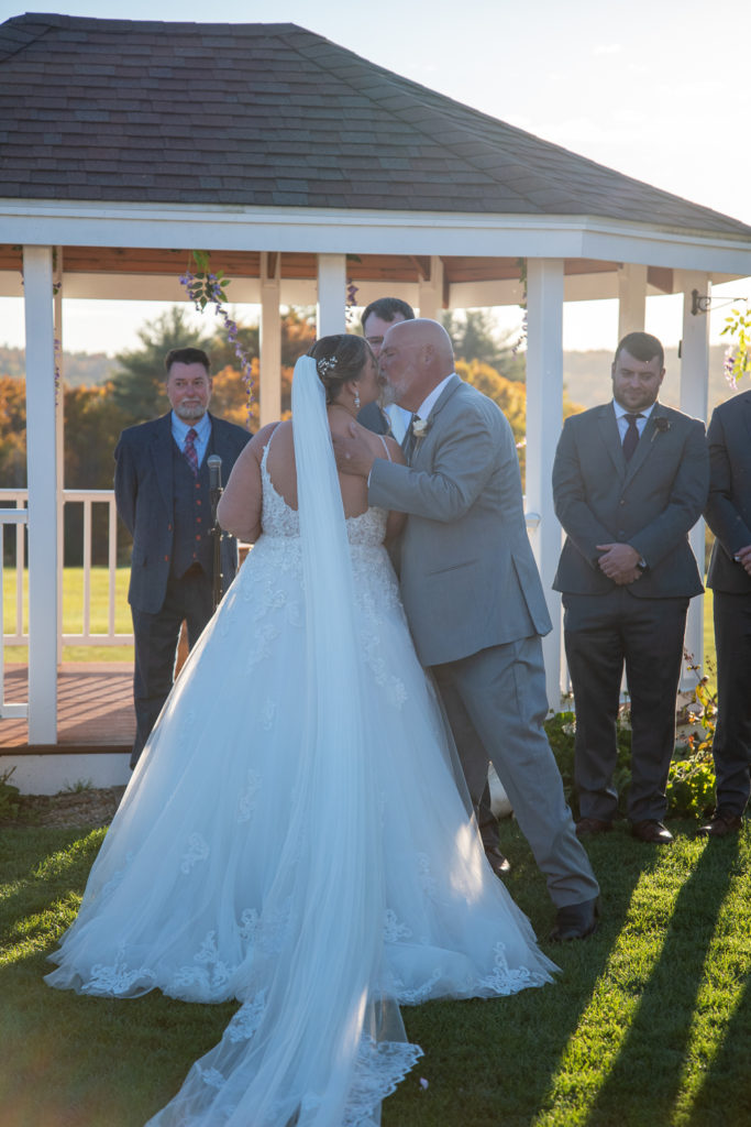dad giving his daughter away at the perfect fall wedding