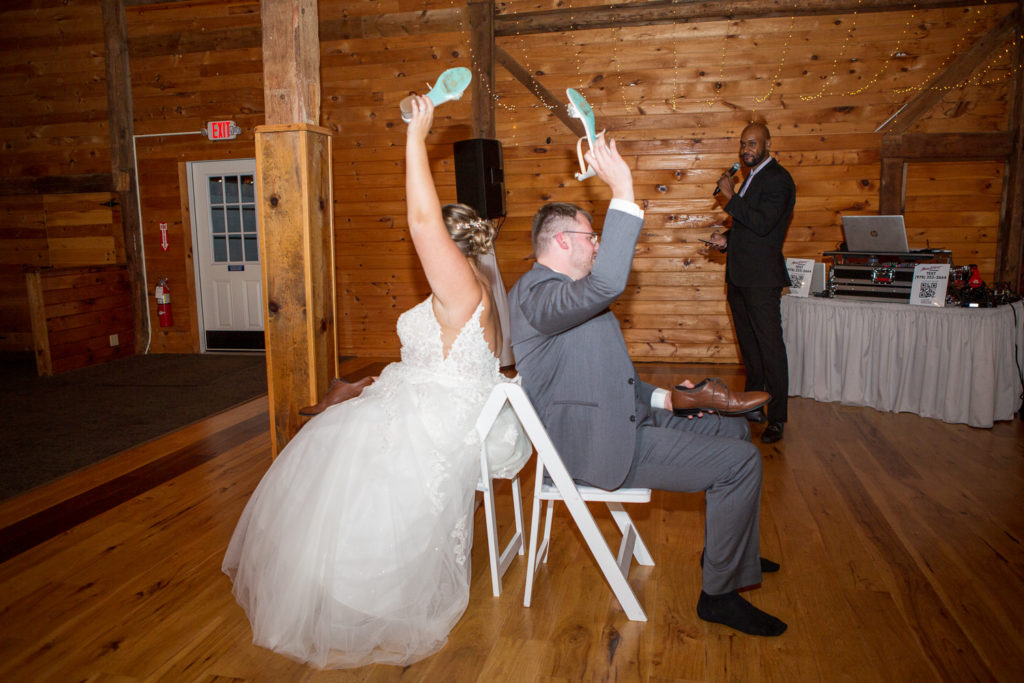 bride and groom playing the shoe game