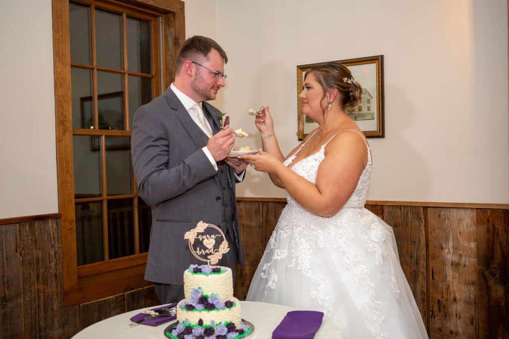 bride and groom cutting the cake at the perfect fall wedding
