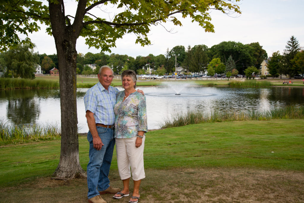 Sixty Years of marriage standing by a tree and pond