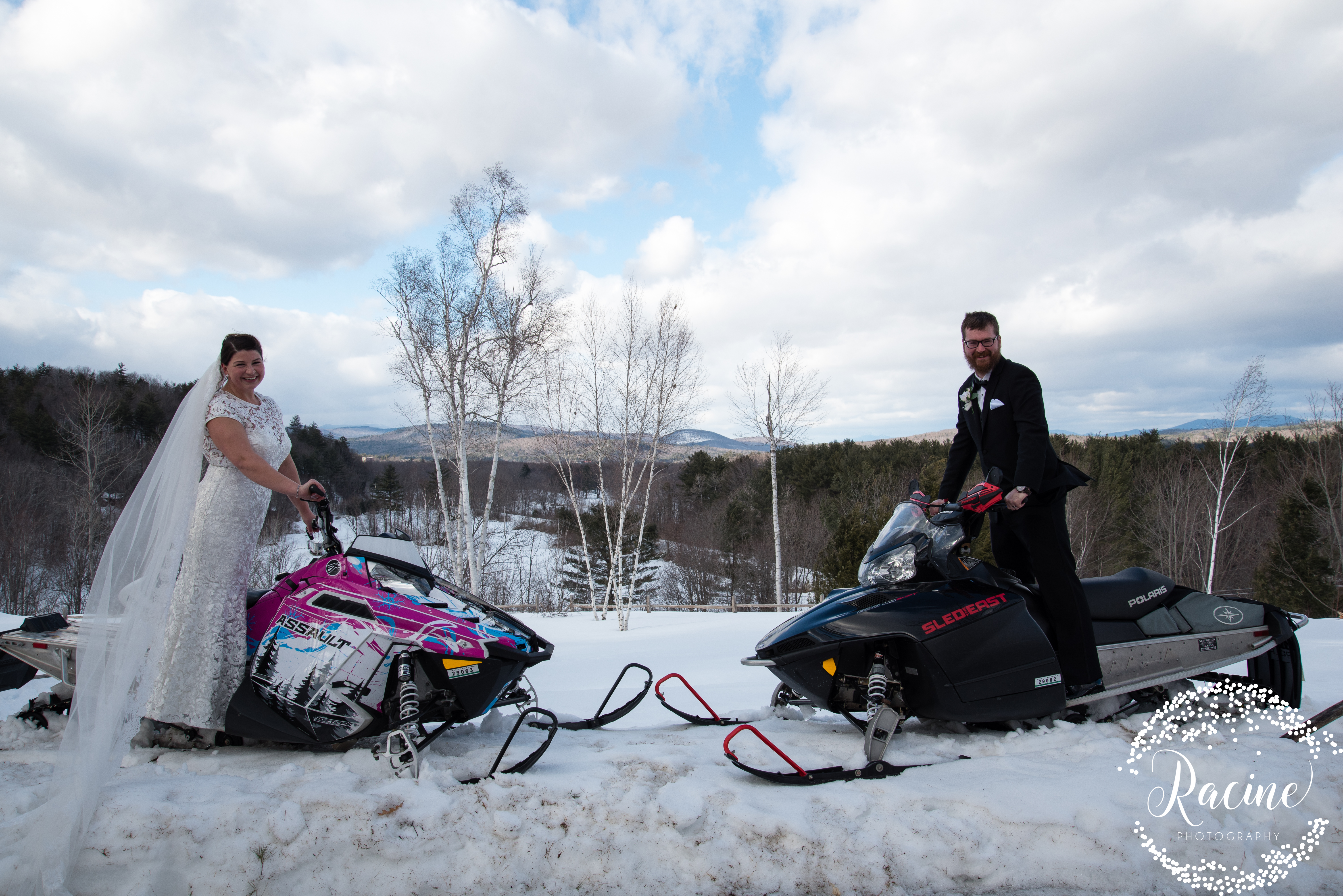 bride and groom on snowmobiles