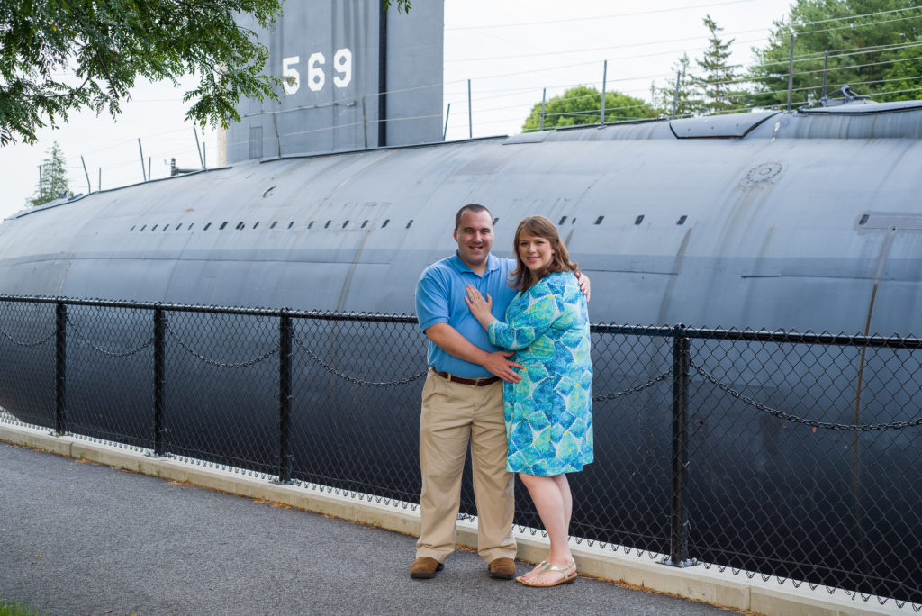 bride and groom in front of the submarine