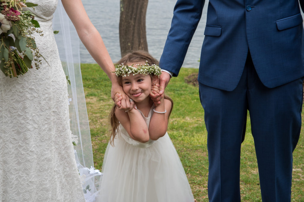 up close of the flower girl, daughter of bride and groom 