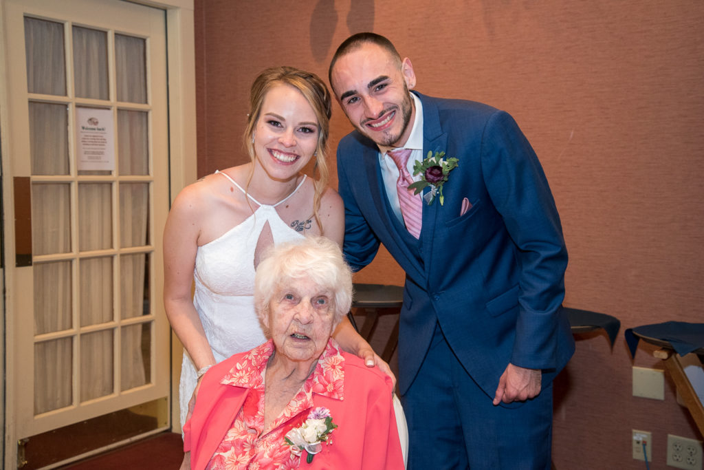 Bride and groom with the great-grandmother of the bride