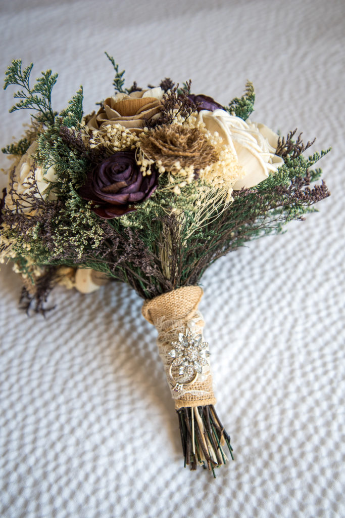 wooden flower bouquet with a special ring tied on
