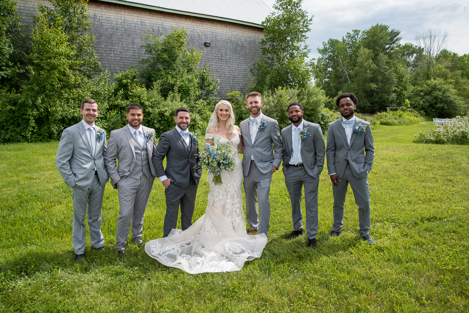bride with groomsmen at the perfect day