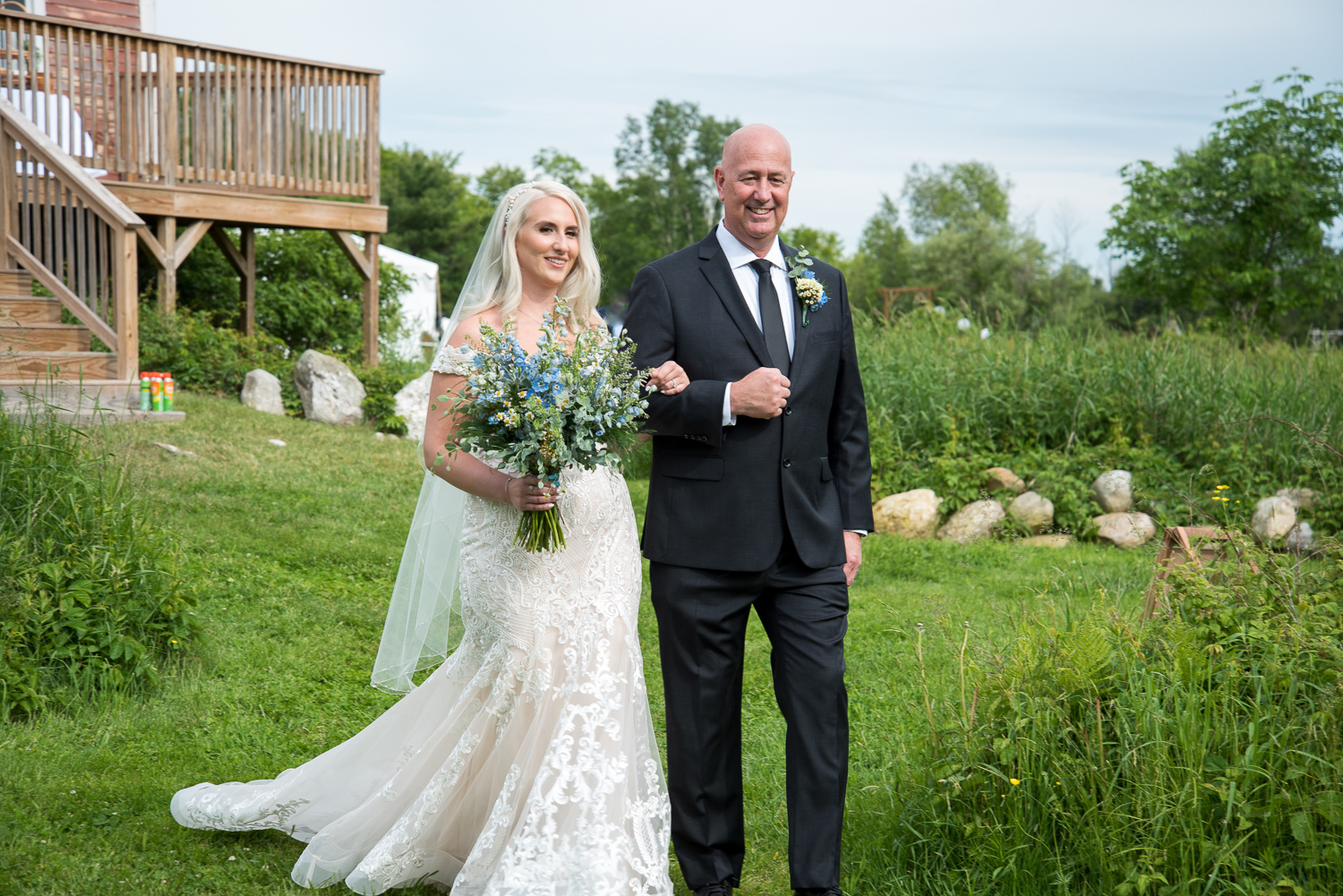 bride and her dad walking down the aisle at the perfect wedding day at Whitney Farm Estate