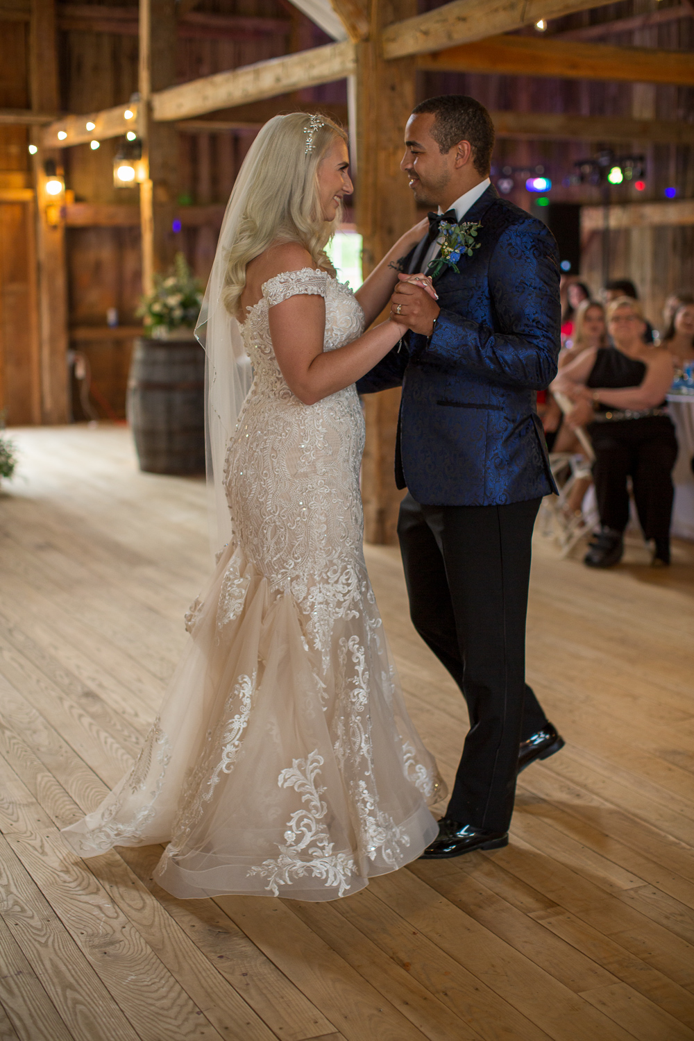 bride and groom first dance in the whitney farm estate barn at the perfect day