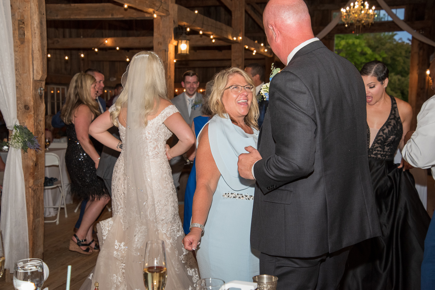 bride's parents partying at the reception of the perfect day 