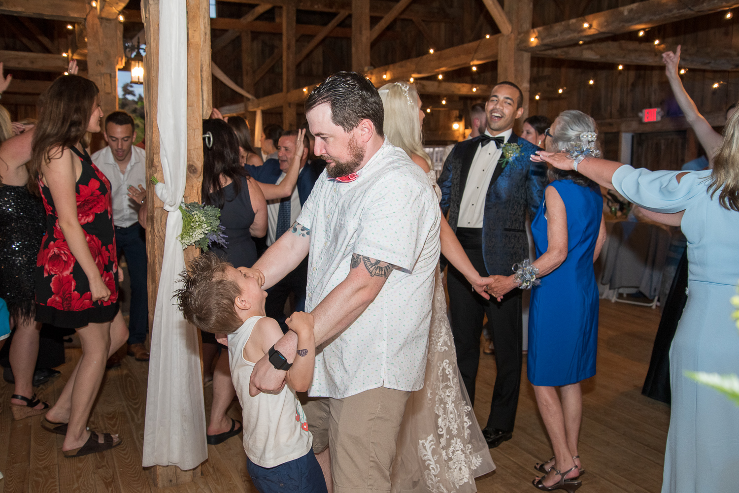 wedding guests dancing and having fun at the perfect day at whitney farm estate 