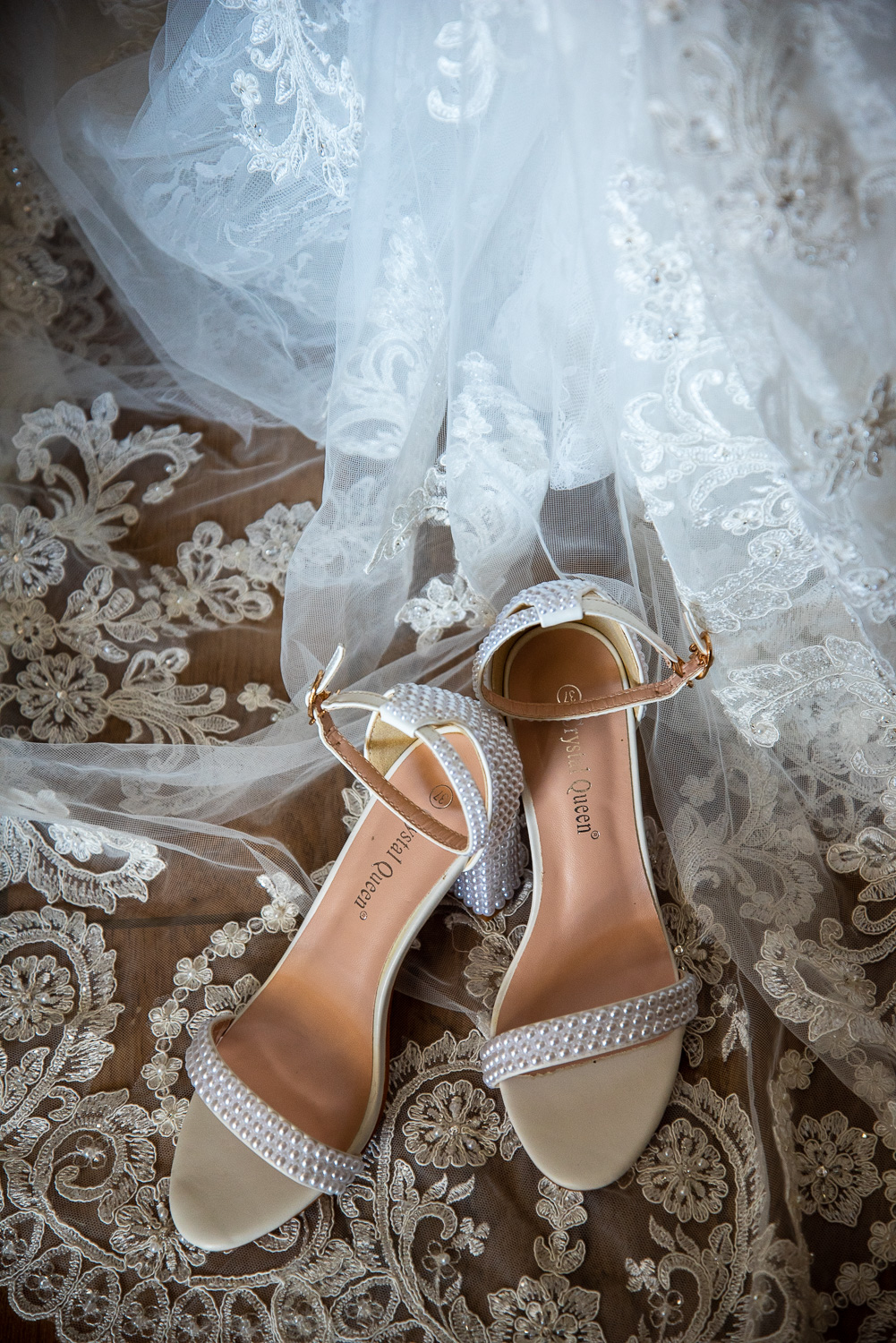 Brides shoes on the wedding dress