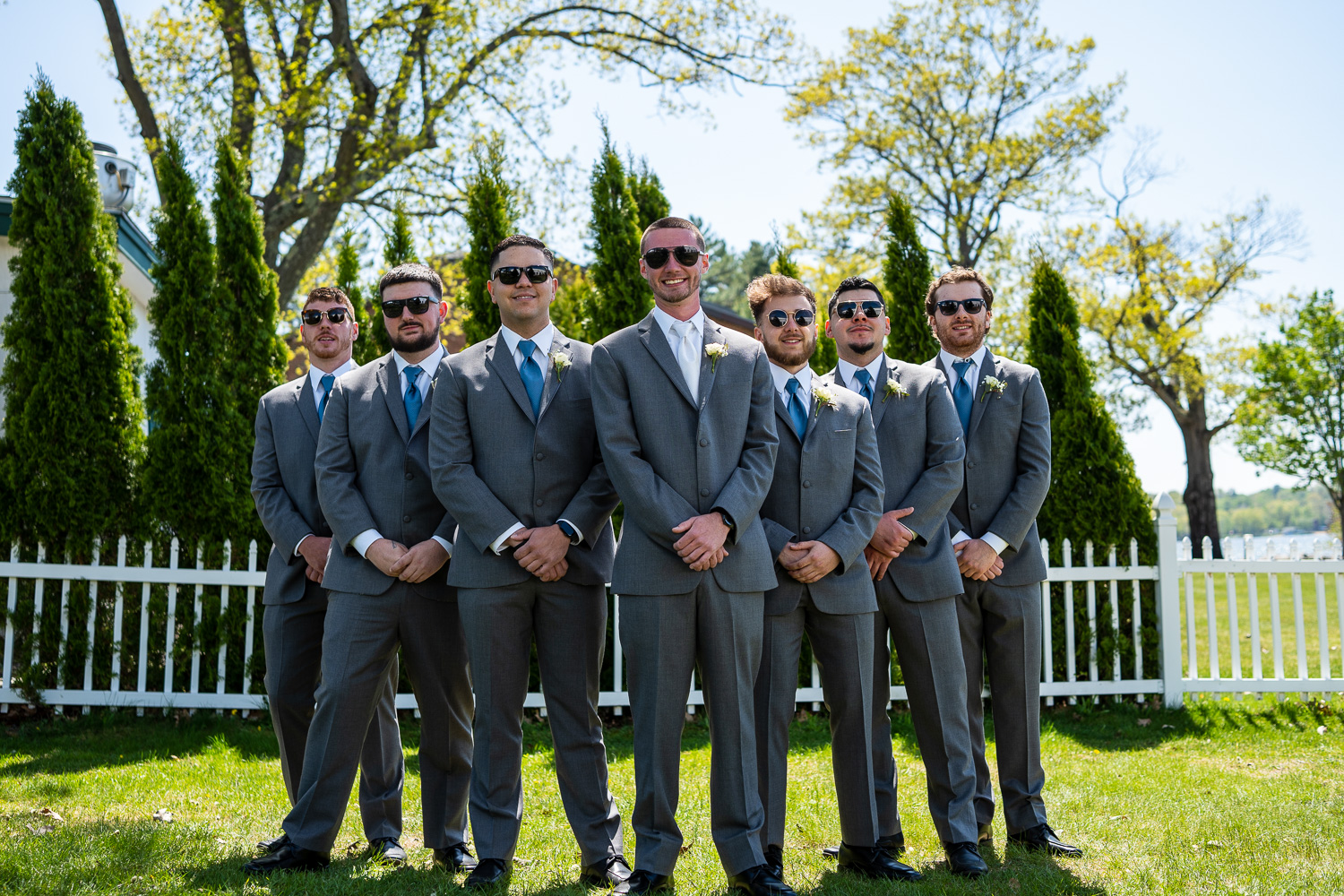 Groom and groomsmen getting ready for the lakeside wedding