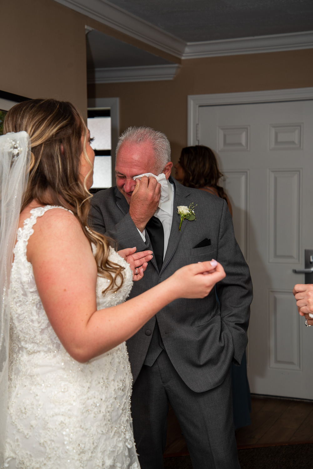 Brides' dad crying after seeing the bride in her wedding dress