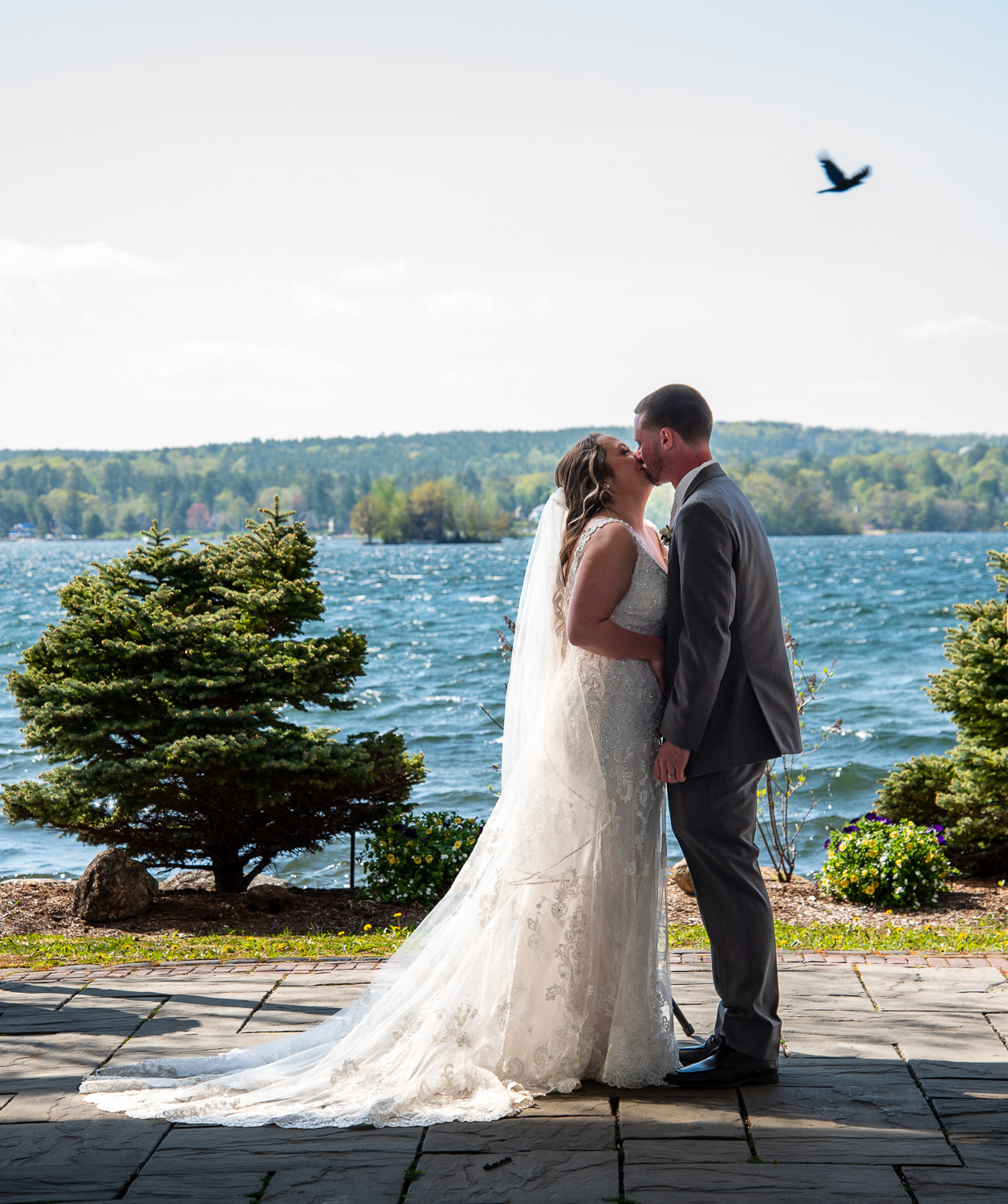 Bride and Groom kissing during the lakeside wedding 