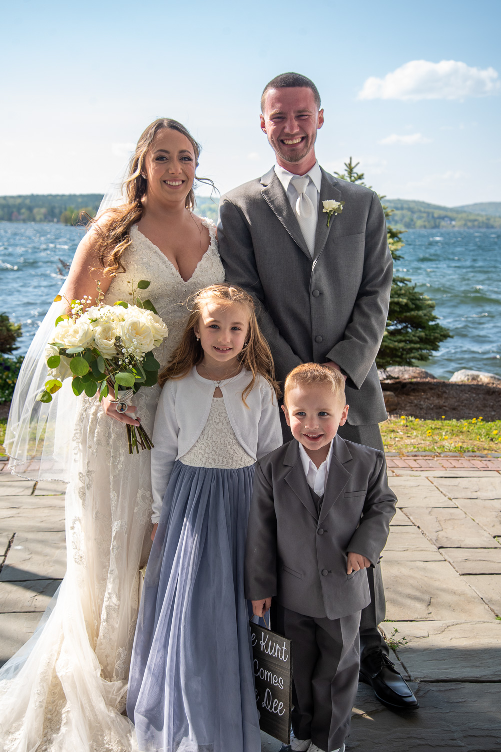Bride, Groom, Flower girl and ring bearer after the lakeside wedding