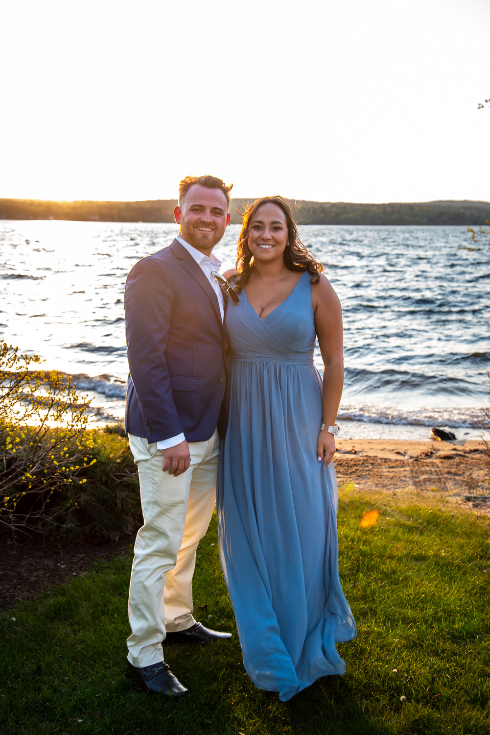 Sunset photos of guests at the lakeside wedding
