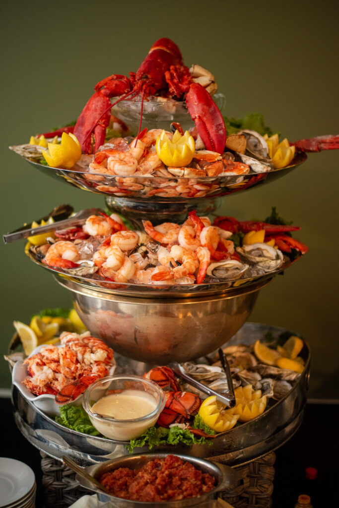 elaborate seafood tower at a wedding with a view