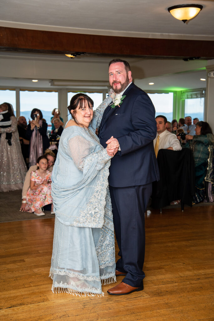 groom dancing with his mom at his wedding with a view 