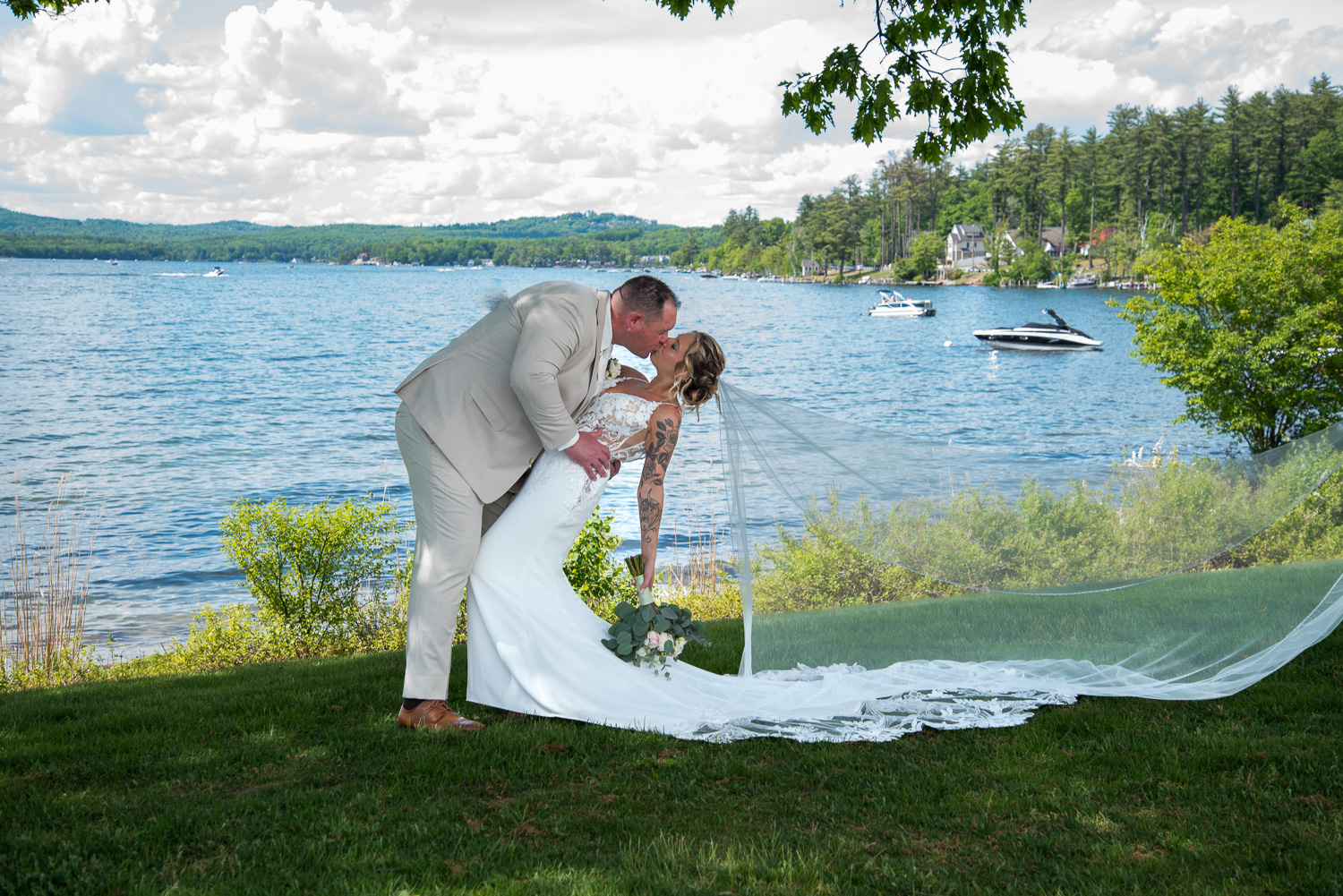 The groom dipping the bride after the Lake Winni Wedding